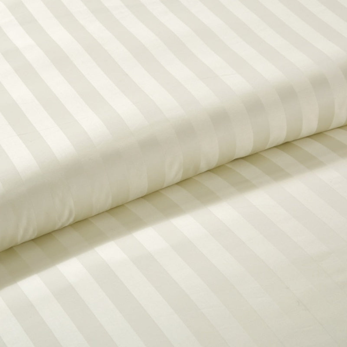 Macro view of the soft stripe pattern on the duvet cover, illustrating its subtle design and gentle sheen.