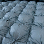 Close-up of tufted quilt pattern on LINKORI Blue Luxurious comforter showing architectural stitch detail and soft structure.
