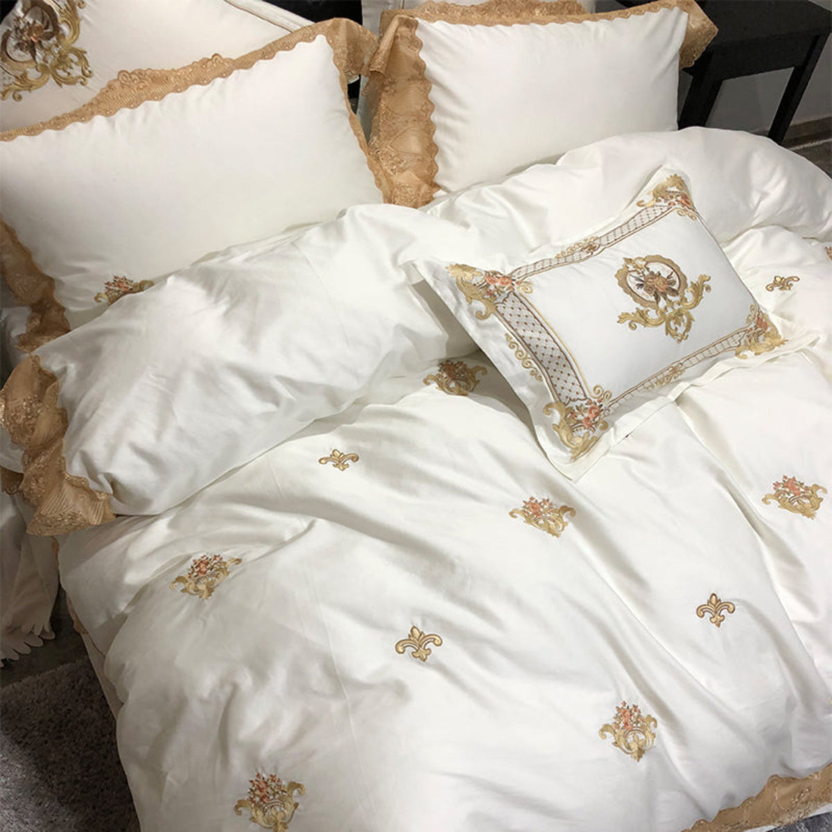Top-down shot of LINKORI Stonge Royal luxury bedding set showcasing symmetrical embroidery and elegant gold trim