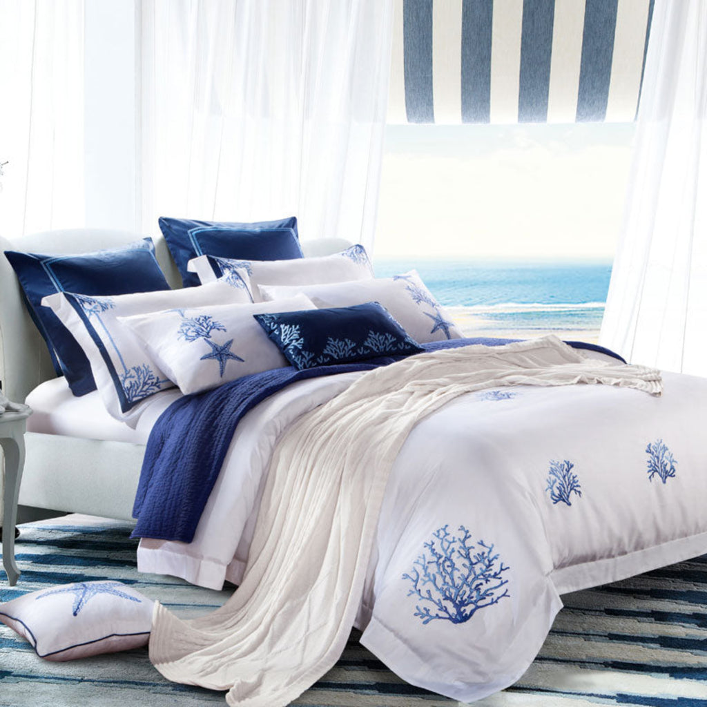 Side view of LINKORI Blue Coral bedding set highlighting embroidered pillowcases and layered coastal styling