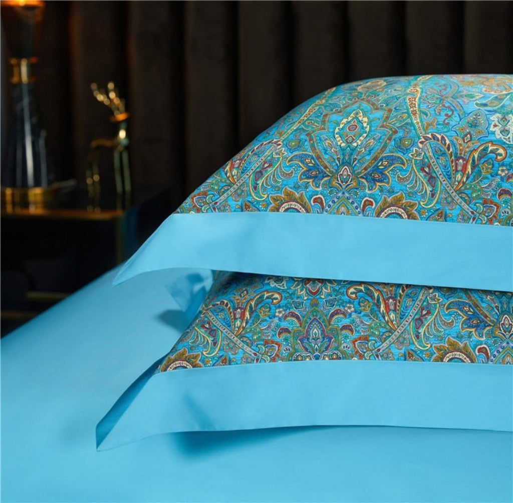Turquoise flat sheet with two decorative pillows — 1000TC Egyptian cotton luxury bedding for art-deco, bohemian luxe, and coastal luxury bedrooms.