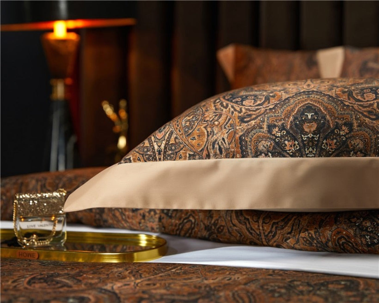 Close-up of Zuvric’s intricate vintage-inspired paisley design — a castlecore textile with rich detail and warm brown tones.