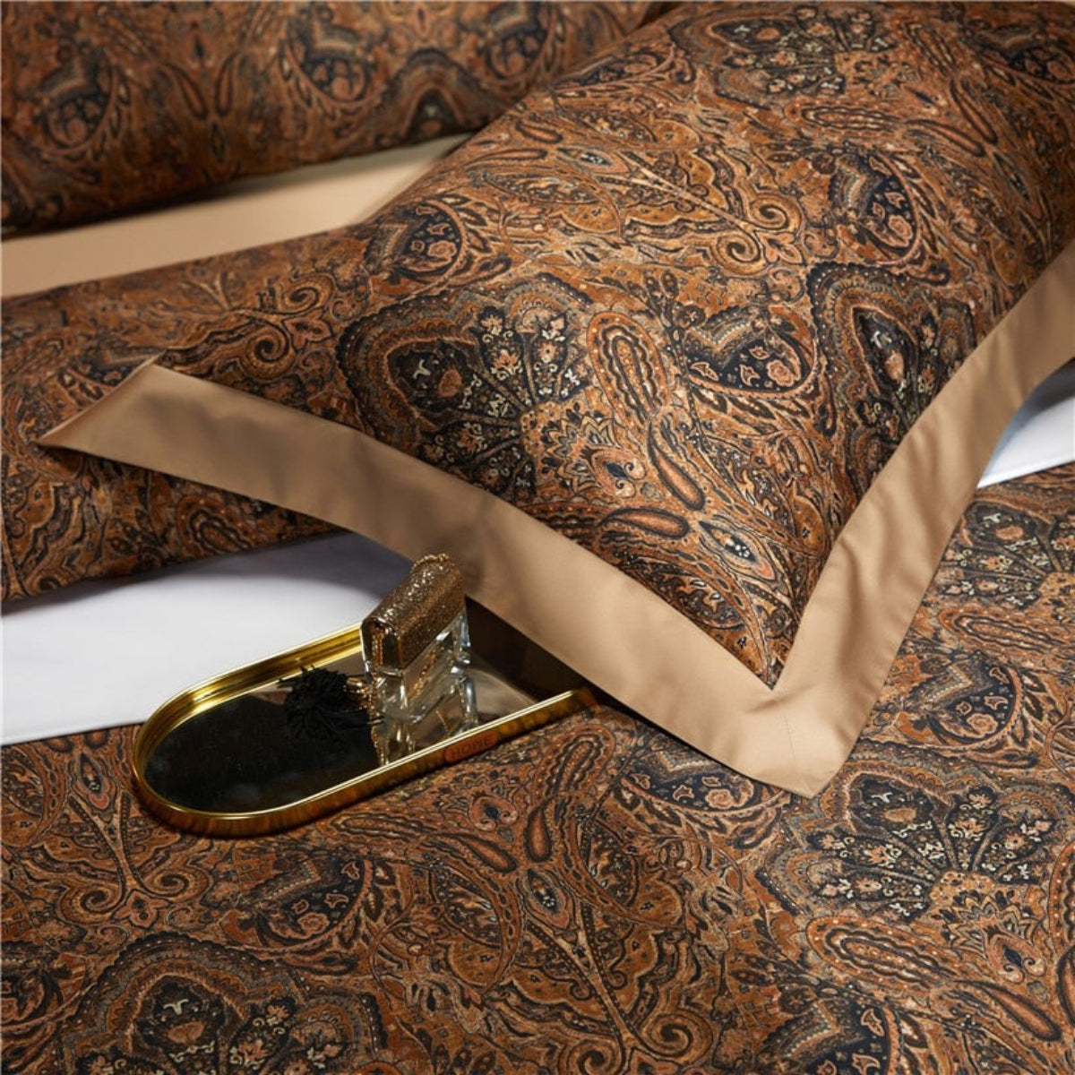 Detailed view of the brown paisley motif on Zuvric pillow cover — castlecore elegance with vintage textile charm in every thread.