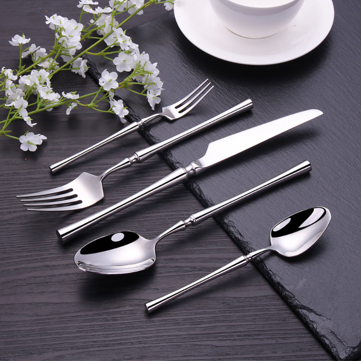 Lilla Silver Shining mirror-polished stainless steel flatware set on grey woven napkin — 5-piece place setting (dinner knife, dinner fork, dinner spoon, salad/dessert fork, teaspoon), 304/420 luxury cutlery, modern minimalist table | LINKORI