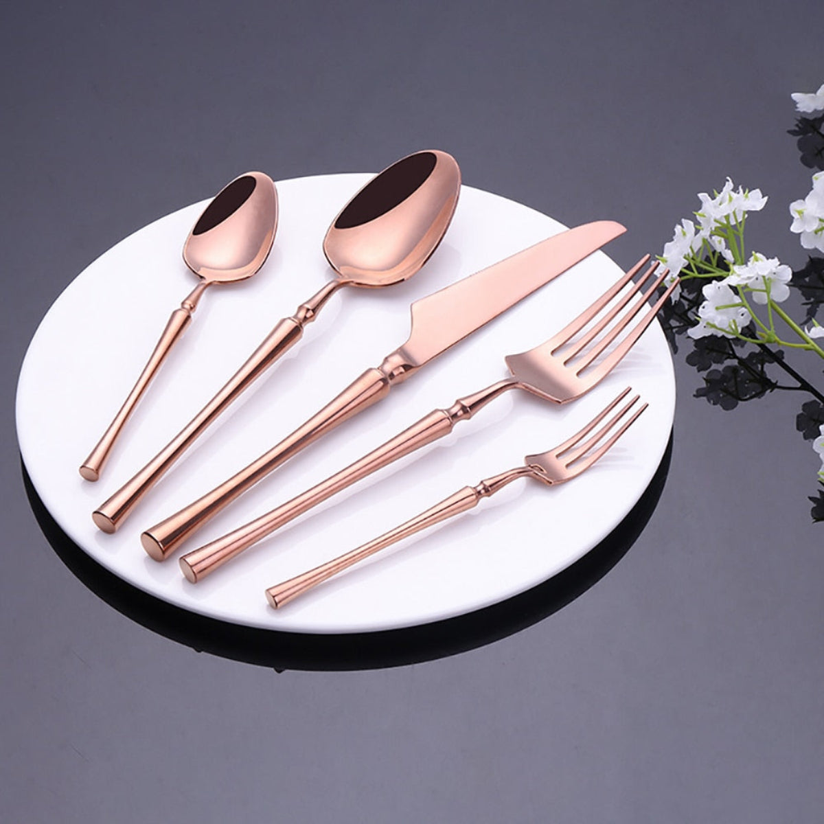 Full 5-piece mirror polished rose gold flatware set neatly aligned – LINKORI Lilla cutlery for luxury dining