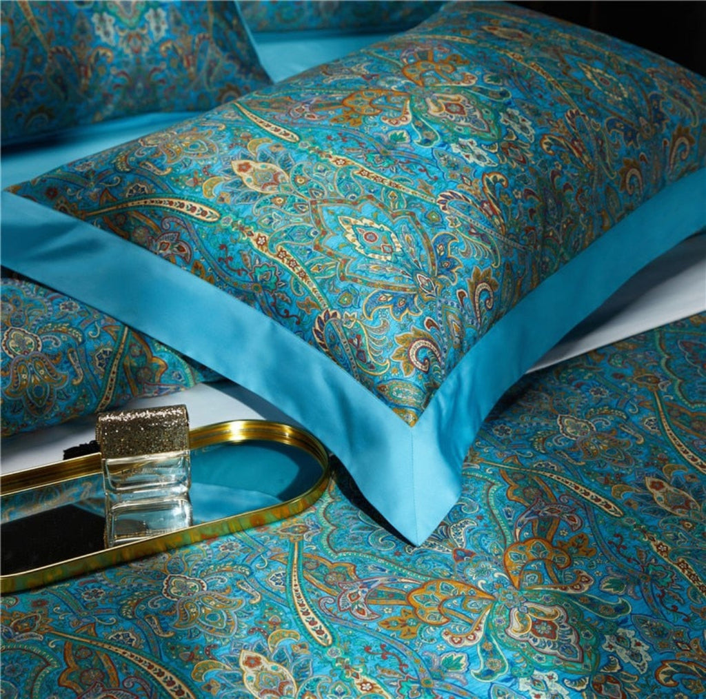  Close-up of patterned pillows — Golden-accented paisley Egyptian cotton bedding for luxury, vintage, and boutique hotel interiors.