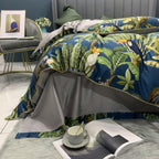 Top view showing grey flat sheet subtly bordered with tropical leaf print for a refined botanical finish.

