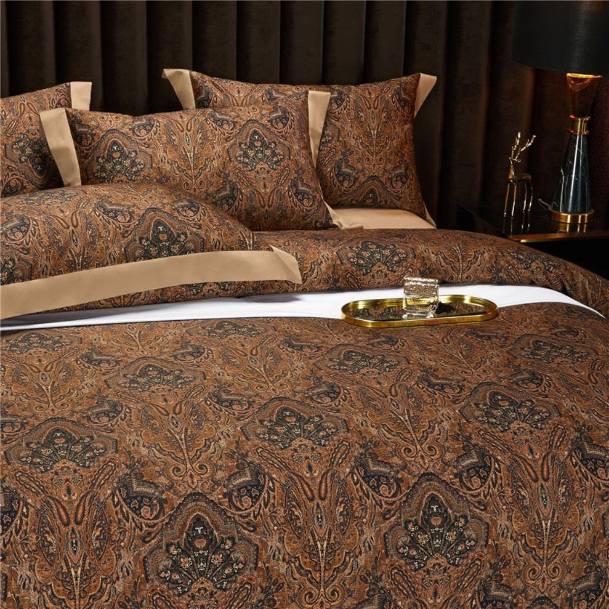 Close-up view of LINKORI Zuvric 4-piece bedding set showcasing 1000-thread count Egyptian cotton and ornate brown paisley pattern with golden trim.