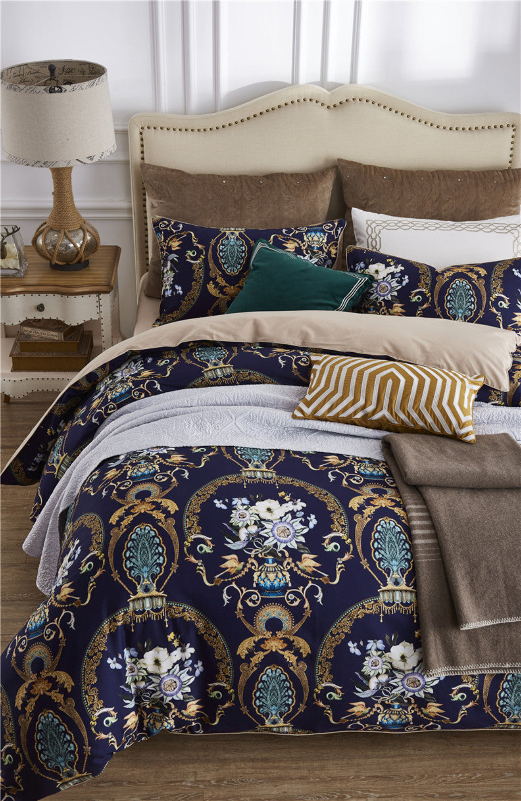 Full bedding display with royal baroque floral print in navy and gold – styled with accent pillows and layered textures | LINKORI Doquar