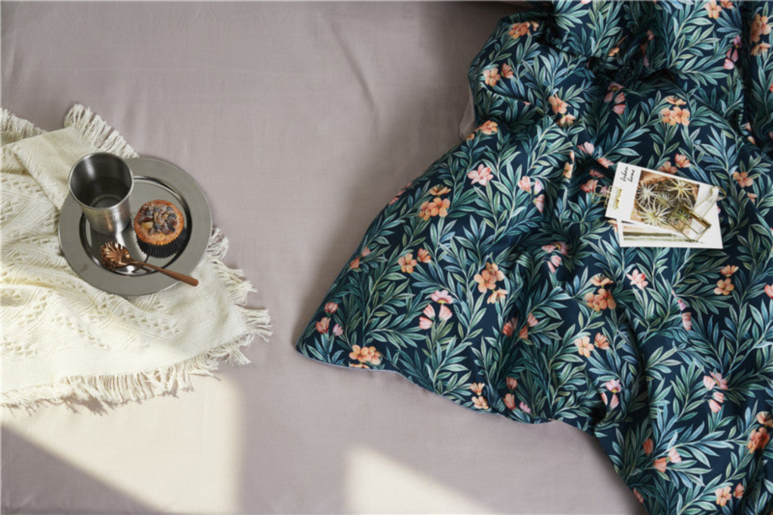 Close-up of botanical floral print on duvet cover – soft blush flowers and greenery over teal cotton | LINKORI On the Grass