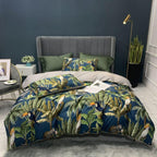 Full view of LINKORI Junglia duvet cover set in tropical bird and leaf print, styled with green pillows and a grey headboard.