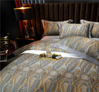 Close-up of detailed paisley pattern on duvet cover and pillow – gold and powder blue accents on jacquard cotton for classic interiors | LINKORI, texture close-up