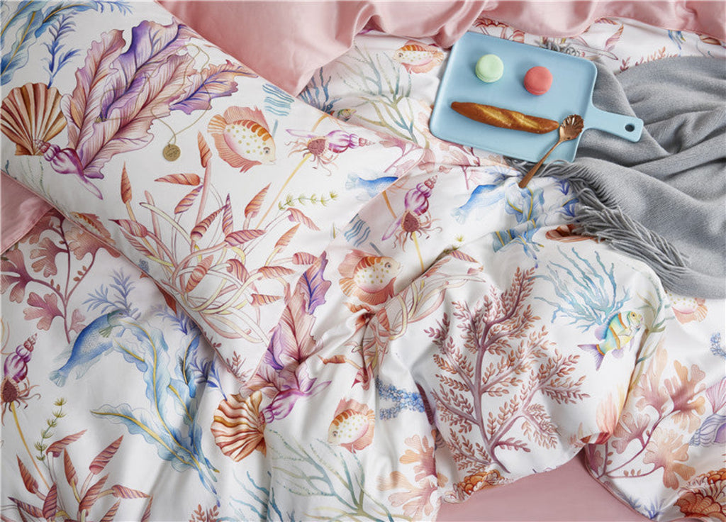 Close-up of coral and seashell pattern on LINKORI Pinklavel duvet and pillow – marine botanical print on soft cotton

