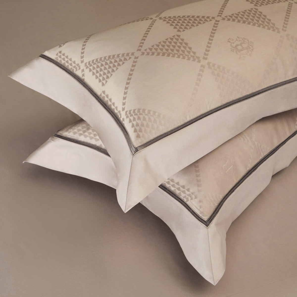 Beige pillowcases on matching flat sheet with geometric pattern and satin trim for minimalist bedrooms | LINKORI Glotia